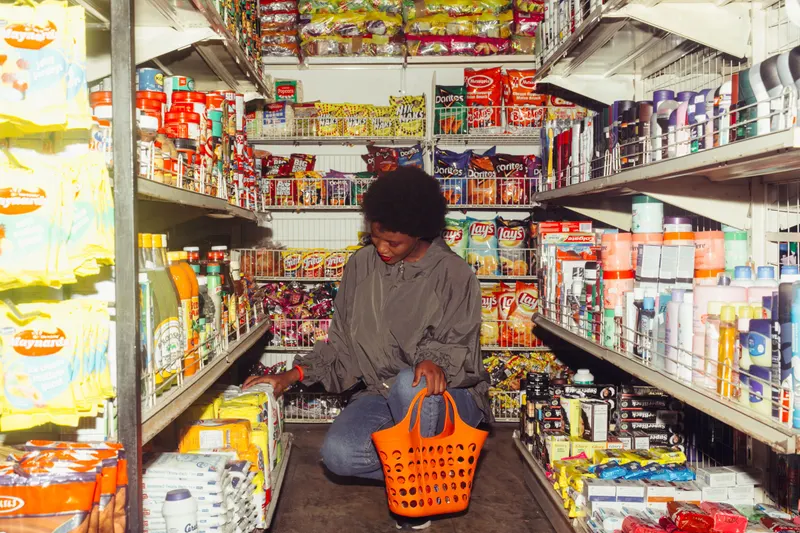 Customer browsing a high street convenience store fitted with commercial freezers by Fridges Direct