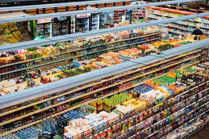 Refrigerated multi deck display aisle stocked with chilled produce supplied by Fridges Direct Ruthin