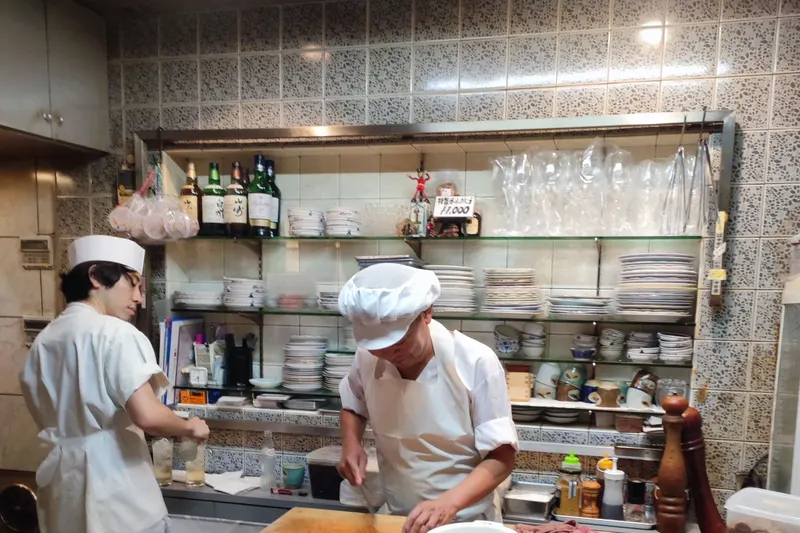 Chefs working in a commercial kitchen served by freezer storage from Fridges Direct North Wales